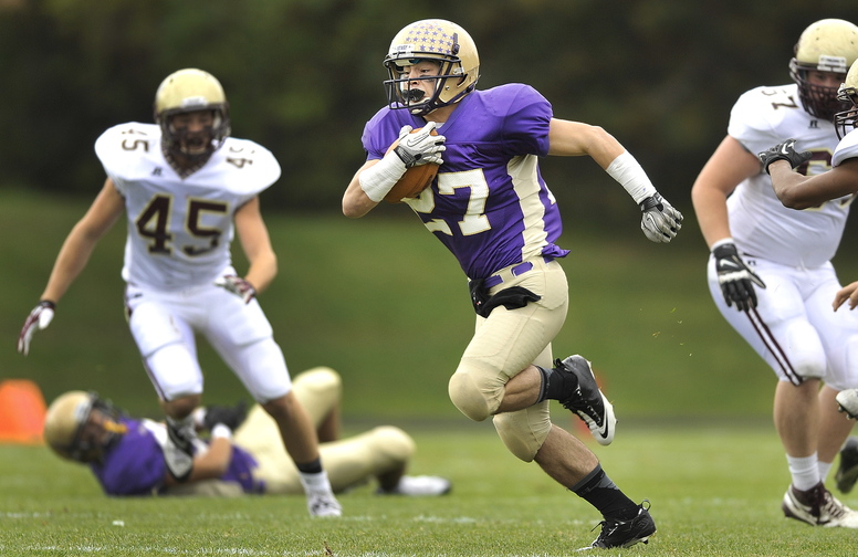 Joe Fitzpatrick of Cheverus breaks away from the Thornton Academy defense early in the first half on Saturday. Fitzpatrick scored six TDs as Cheverus dumped Thornton Academy, 56-7.