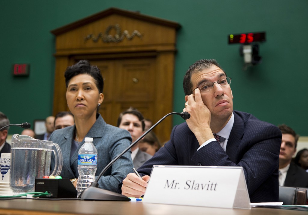 Cheryl Campbell, senior vice president of CGI listens at left as Andy Slavitt, representing QSSI’s parent company, testifies on Capitol Hill Thursday before the House Energy and Commerce Committee hearing with contractors that built the federal government’s health care websites. The contractors responsible for building the troubled HealthCare.gov website say it was the government’s responsibility – not theirs – to test it and make sure it worked.