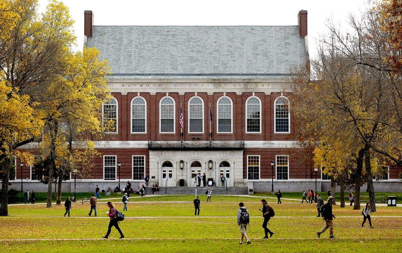 Students and faculty members cross the mall at the University of Maine in Orono last week. Amid increasing competition, college recruiters are focusing on nontraditional students and those from other New England states as they try to boost Maine’s falling enrollment numbers.