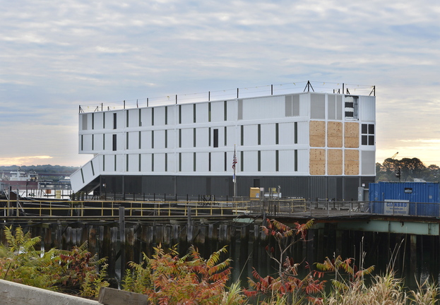 A barge holding a mysterious four-story structure has been tied up at Cianbro Corp.’s Rickers Wharf Marine Facility off Commercial Street in Portland since its arrival on Oct. 11.