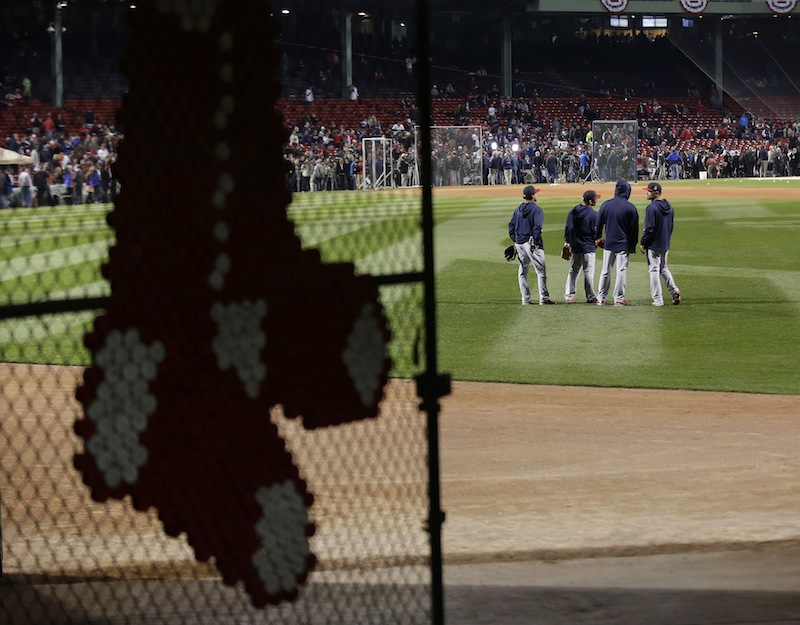 St. Louis Cardinals players stand in the outfield during batting practice before Game 1 of baseball's World Series against the Boston Red Sox Wednesday, Oct. 23, 2013, in Boston. MLB