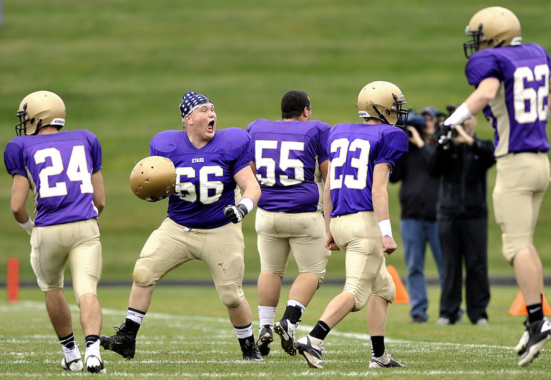 Greg Grinnell leads the cheers after Cheverus recovers a fumble. Grinnell was part of an offensive line that kept Thornton Academy on its heels throughout.