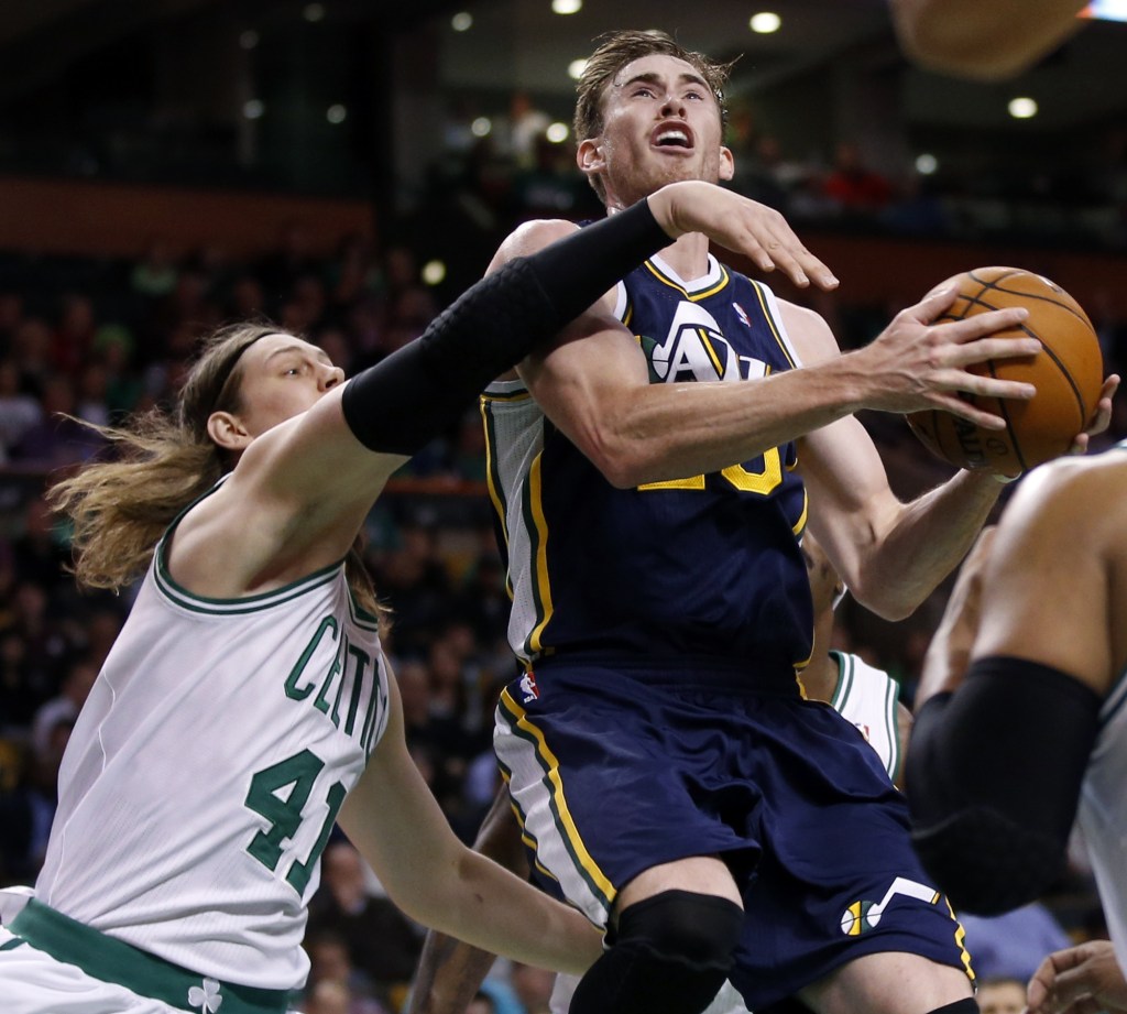 Utah Jazz forward Gordon Hayward (20) drives against Boston Celtics forwards Kelly Olynyk (41) and Jared Sullinger (7) during the first quarter of an NBA basketball game in Boston on Wednesday, Nov. 6, 2013. (AP Photo/Elise Amendola)