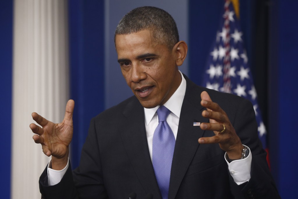 President Barack Obama gestures as he speaks about his signature health care law, Thursday, Nov. 14, 2013, in the Brady Press Briefing Room of the White House in Washington. Bowing to pressure, President Barack Obama intends to permit continued sale of individual insurance plans that have been canceled because they failed to meet coverage standards under the health care law, officials said Thursday.