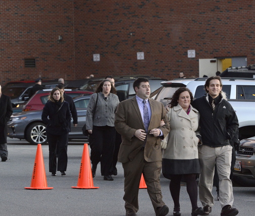 Attendees leave a memorial service for Brendan Conway at Deering High School in Portland on Tuesday.