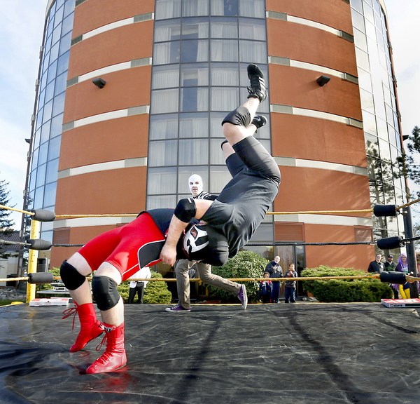 Jacob “Magnus Buho” Cote and Antoine “Diablo Blanco” Malaab, both of Portland, wrestle in a match Saturday at Coast City Comicon. The convention also features artists, crafts people, music, dancing and horror films. It continues from 11 a.m. to 6 p.m. Sunday. Admission is $25.