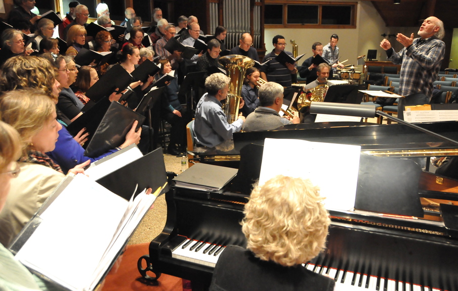 Music director Harry Moon, far right, leads members of the Community Chorus at South Berwick through a dress rehearsal in advance of two planned concerts this week. The chorus will perform two concerts of “A Boy Was Born” this weekend in South Berwick and Newington, N.H., offering a selection of music spotlighting modern choral composers.