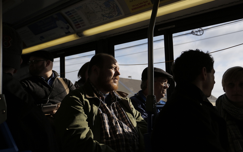 Thomas Ptacek of Homeless Voices for Justice and state Rep. Dick Farnsworth ride the No. 5 bus Tuesday as part of a protest.