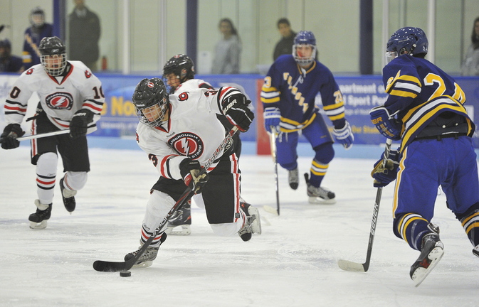 Scarborough’s Matt Caron races the puck into the Falmouth zone during a 2-0 win by the Red Storm on Monday at the Alfond Forum in Biddeford. Scarborough was looking for a measure of revenge after losing to Falmouth, 4-3, in the state tournament last year. ––