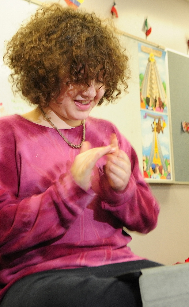 Jacek Twarog, a sixth-grader from Fayette, claps as he plays a program that he coded in the Hopscotch app on an iPad on Friday at Maranacook Middle School in Readfield.