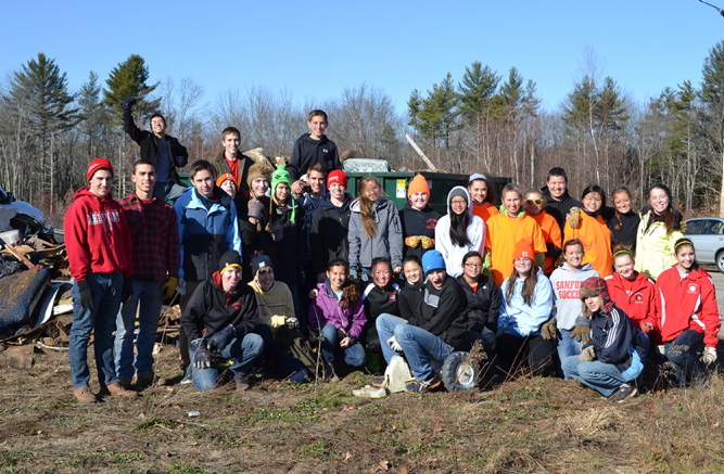 A group of 33 Sanford High School Key Club members and four Kiwanis Club members recently spent a day sprucing up the Sanford Industrial Park. The group spent the morning picking up trash along the paths and in the woods on the property and collected enough to fill two large dumpsters.