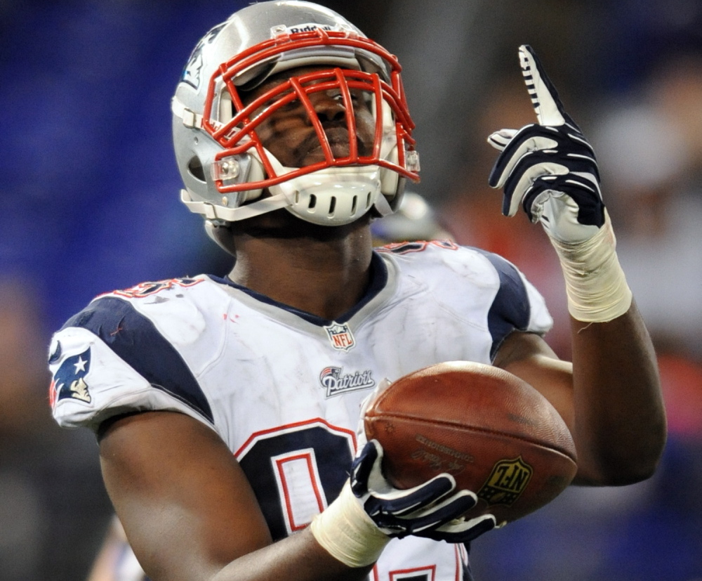 Patriots defensive end Chandler Jones scores a touchdown in the final two minutes of Sunday’s game, recovering a fumble in the end zone against the Ravens at Baltimore.
