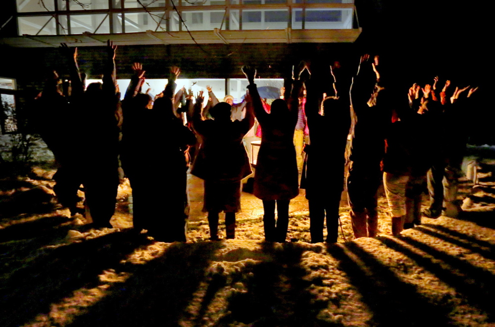 Celebrants gather around a fire to acknowledge the seasonal spirits during a Winter Solstice celebration led by Spirit Passages shamanic healers at Maine Audubon Gilsland Farm in Falmouth on Dec. 21