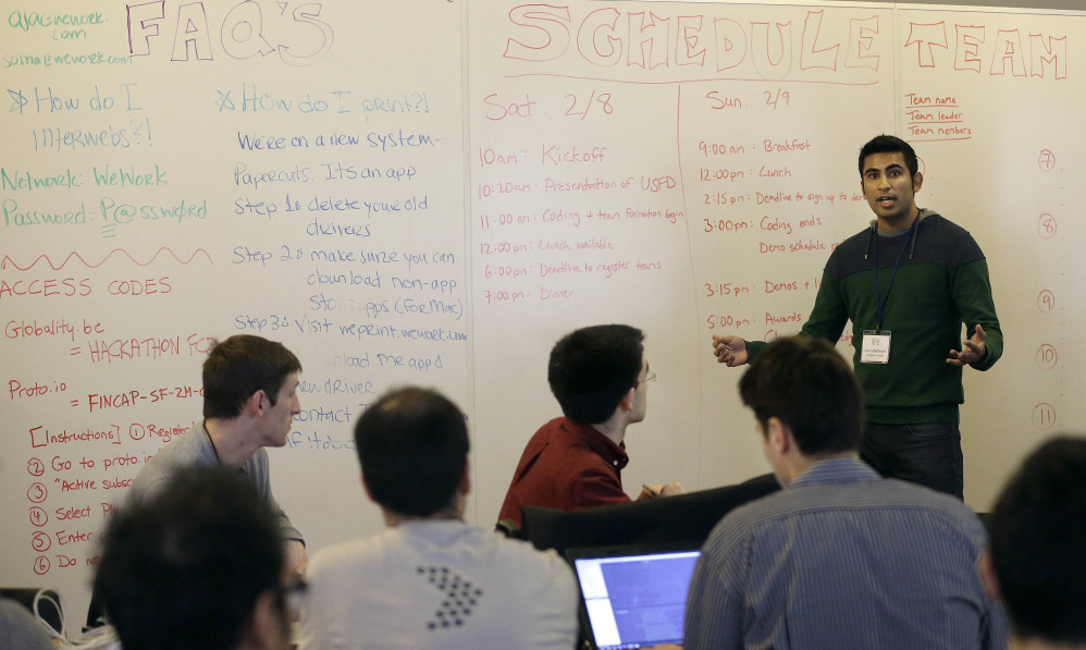 Karim Bhalwani, manager of API Strategy and Sales at Yodlee Interactive, speaks to participants at the FinCapDev San Francisco Hackathon in San Francisco. A record 1,500 hackathons around the world are planned for this year.