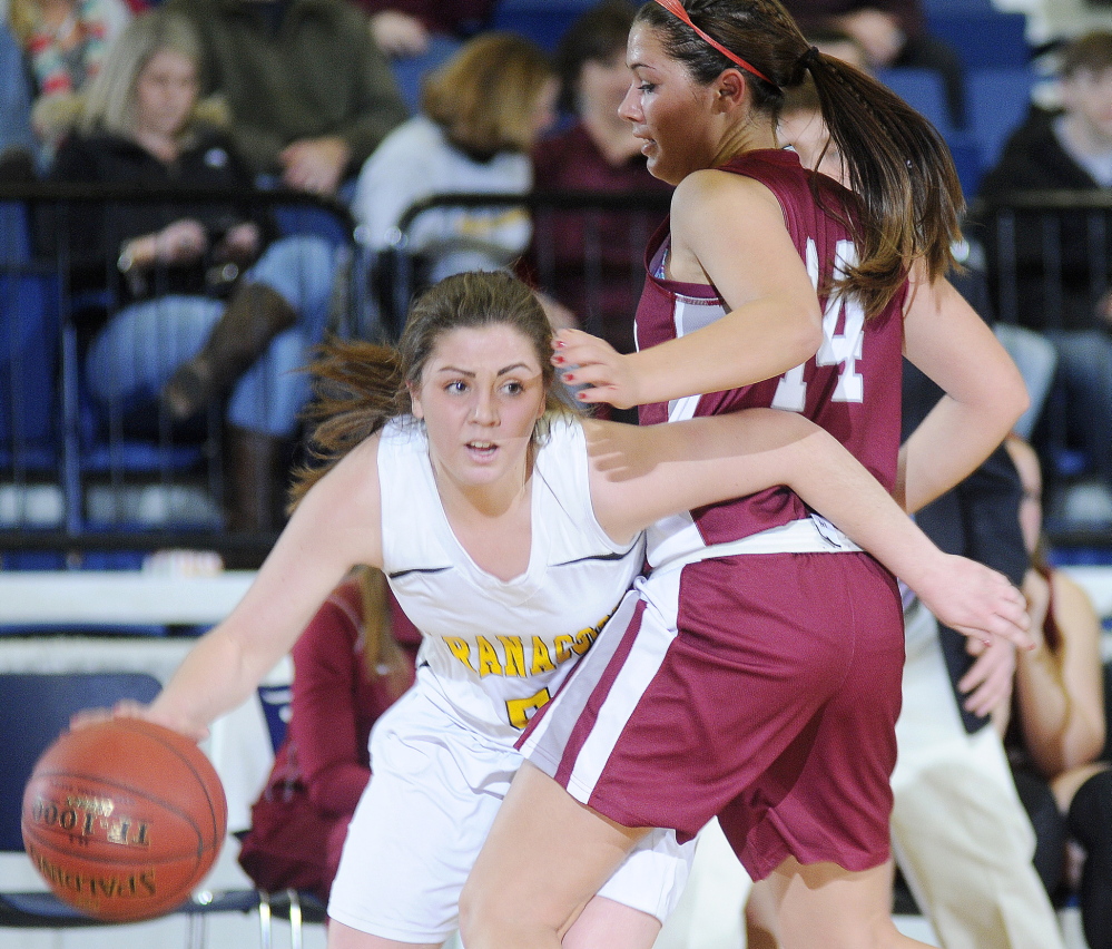 Sarah Clough dribbles around Faith Forsythe of Kents Hill during Maranacook’s 52-39 win Tuesday in a Western Class C girls’ basketball quarterfinal at the Augusta Civic Center.