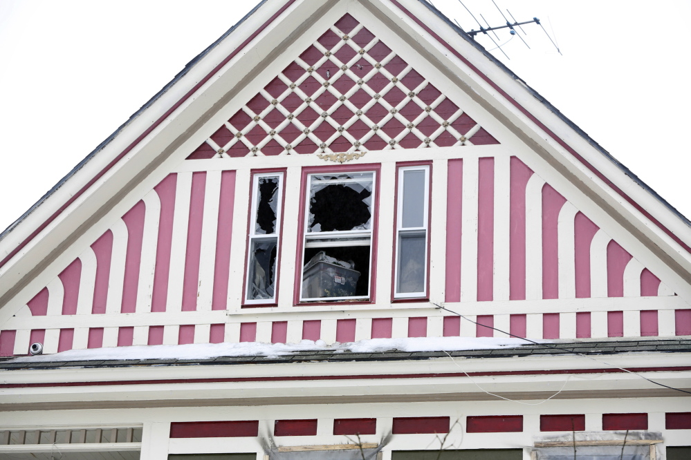 Jon Tanguay and his son Nicholas, 4, escaped a house fire from this house at 62 South St. in Bath.