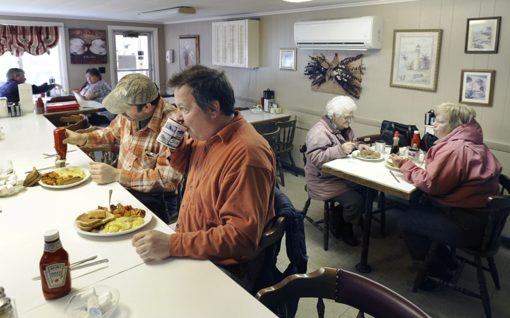 Chris Odlin and Jason Lovejoy, both of Scarborough, enjoy hearty breakfast fare at Guidi’s.