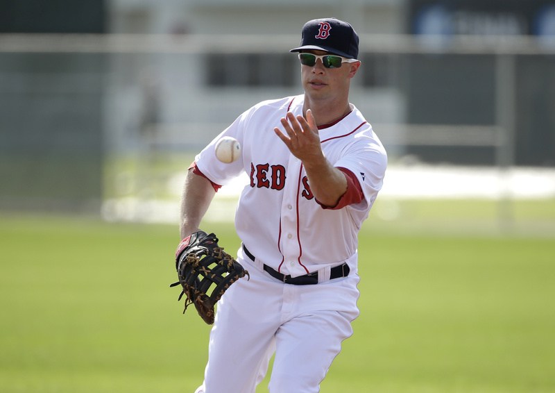 Boston Red Sox right fielder Daniel Nava works out on the field during spring training baseball practice Sunday in Fort Myers, Fla.