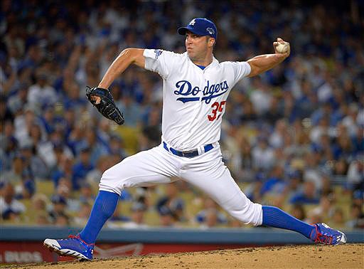 Chris Capuano, shown pitching for the Los Angeles Dodgers, worked out with the Boston Red Sox on Saturday after signing a $2.25 million, one-year contract.