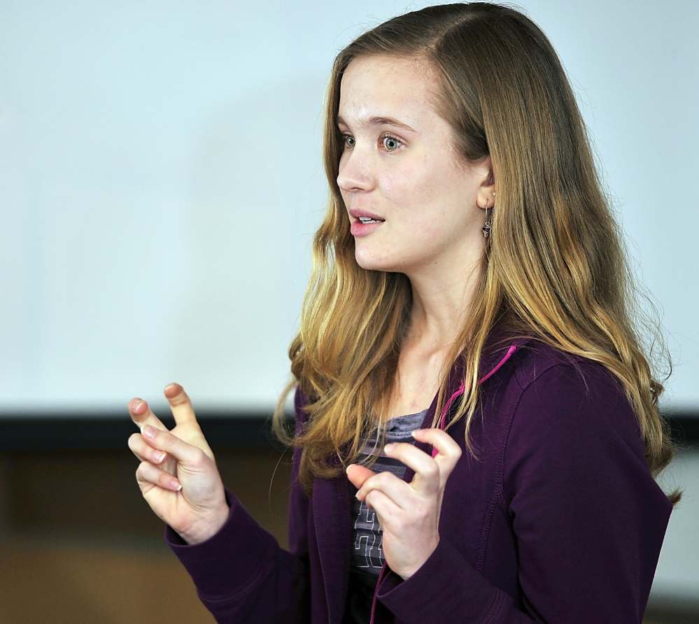 Laura Henny practices her personal speech Monday in front of her teammates and advisers to the Scarborough Academic Decathlon team.