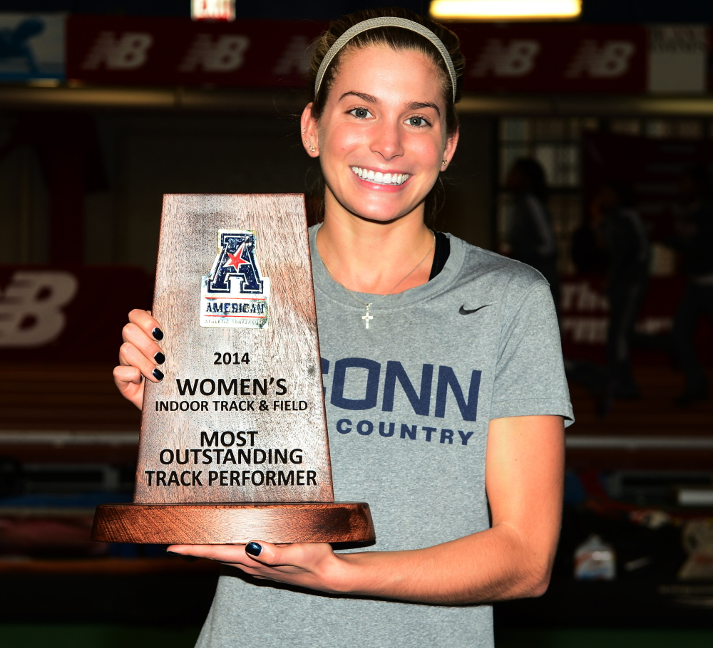 UConn’s Emily Durgin proudly displays the award she won last weekend at the American Athletic Conference indoor track and field meet at New York.