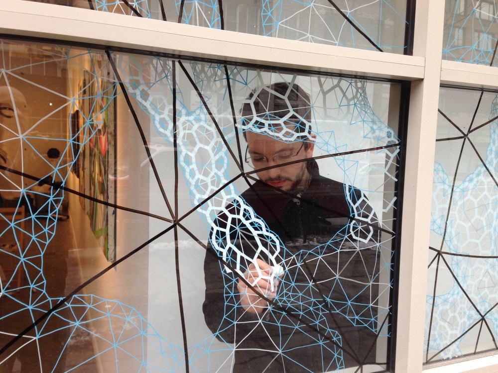 Clint Fulkerson at work on the installation of “Second Nature: Abstract Art from Maine” prior to its opening this month at the Curator Gallery in New York.