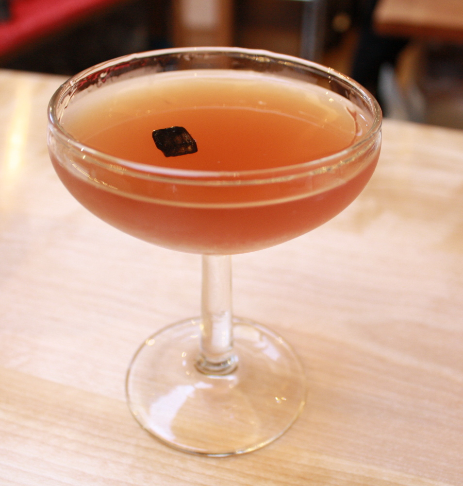 That’s a piece of smoky charcoal in the center of the Gun Smoke, a curiously good cocktail at Vinland for $12.