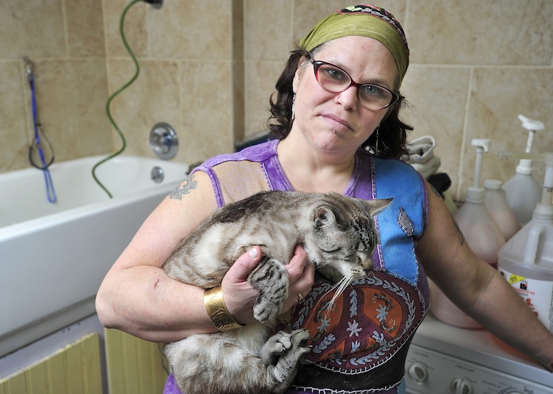 Pet groomer Paulette Tuunanen was recovering Wednesday from injuries to her head, arm and thigh that required about 10 stitches.