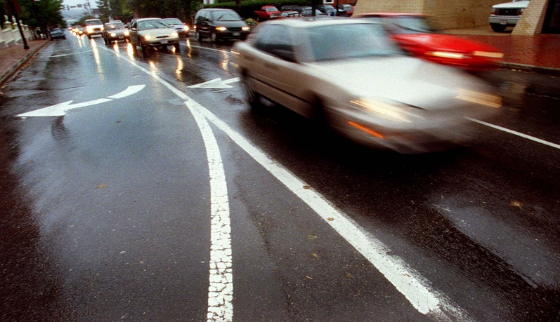 Traffic makes its way up High Street in Portland. Reverting to two-way traffic on the street would slow traffic speeds but also could force the city to eliminate some on-street parking and upgrade intersections.