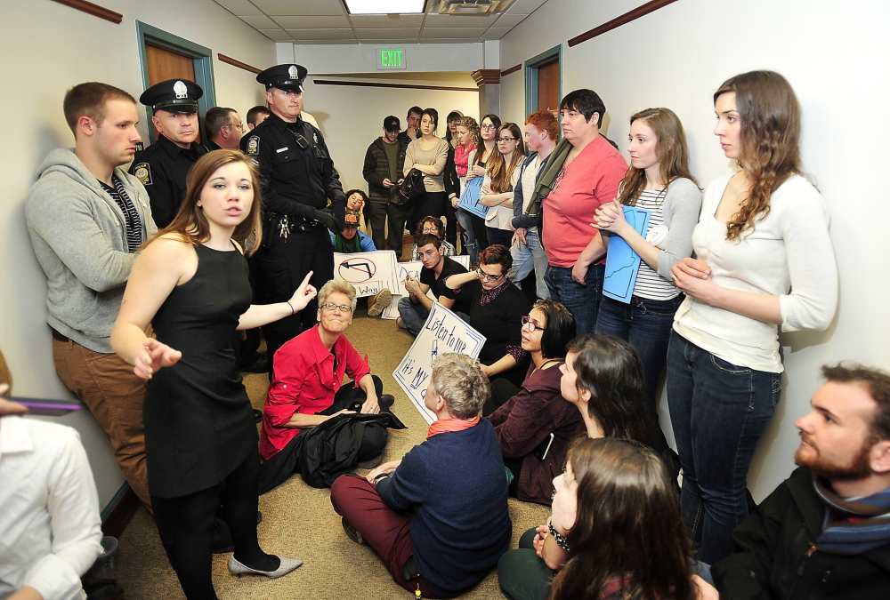 Brittany Hill, a fourth-year student at USM majoring in political science and economics, speaks as students and faculty protest outside offices of USM Provost against program cuts and layoffs in this Thursday, March 20, 2014 photo.