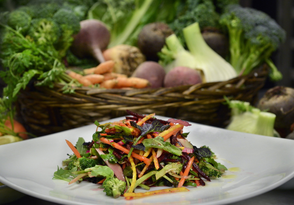 Chef Mitchell Kaldrovich makes a salad of beets, broccoli stems and leaves at his Sea Glass Restaurant at Inn by the Sea in Cape Elizabeth. Kaldrovich sources local products and strives to use them as entirely as possible.