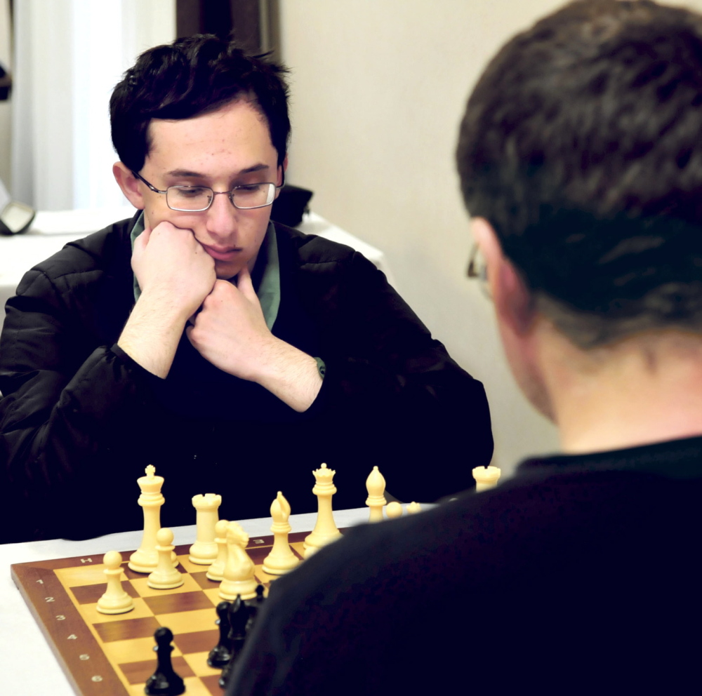 Master chess player Matthew Fishbein, a Cape Elizabeth sophomore, ponders his next move against fellow master Jarod Bryan of Augusta during Sunday’s final match of the two-day Maine Closed Chess Championship in Waterville.