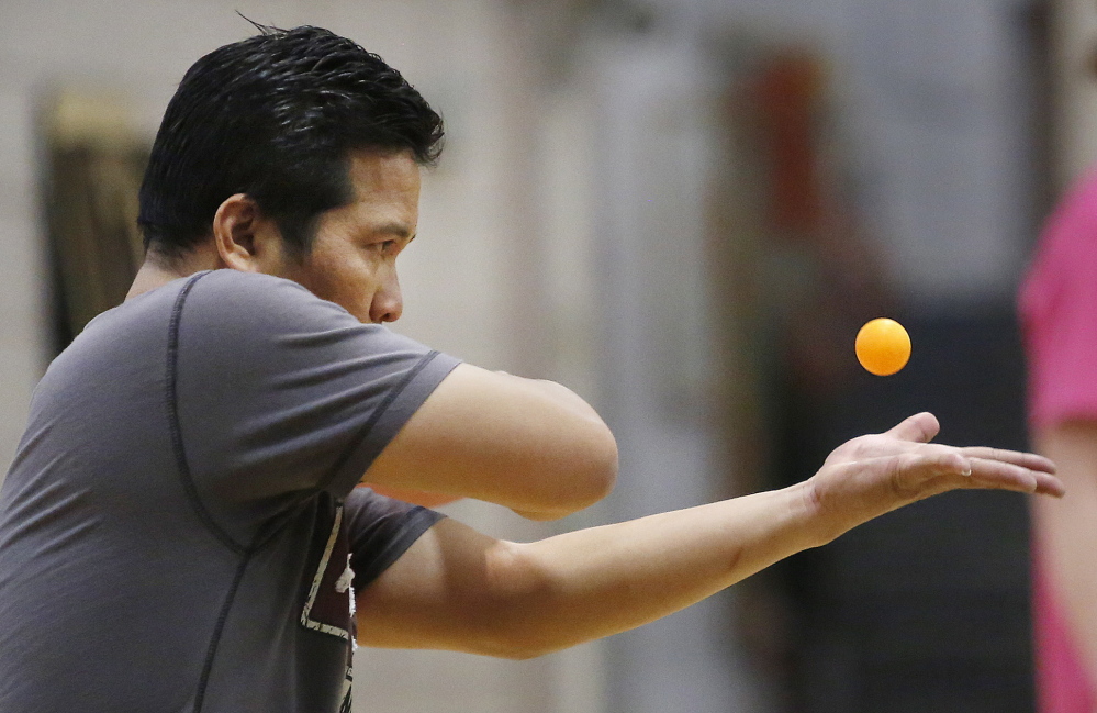 Chris Mesach of Philadelphia serves while competing in Class C.