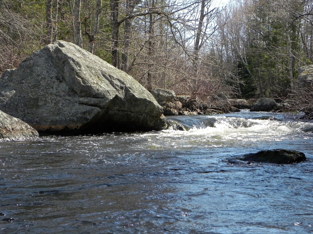 The cascading waters where Hellhole Stream drops into the Dead River can provide a taste of whitewater to your otherwise serene trip to Alamoosook Lake.