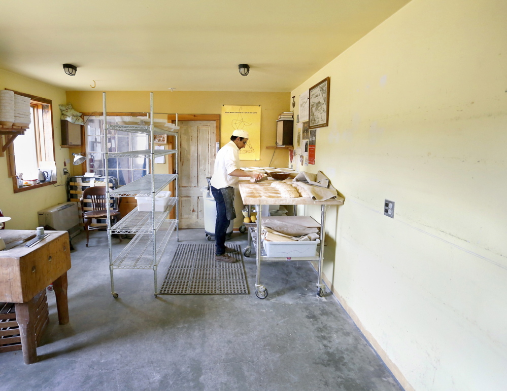 Zu Bakery owner Barak Olins prepares bread in his barn in Freeport. Olins, who got started baking professionally when he and his friends owned a café in Portland in the 1990s, sells his breads at farmers markets in Brunswick.