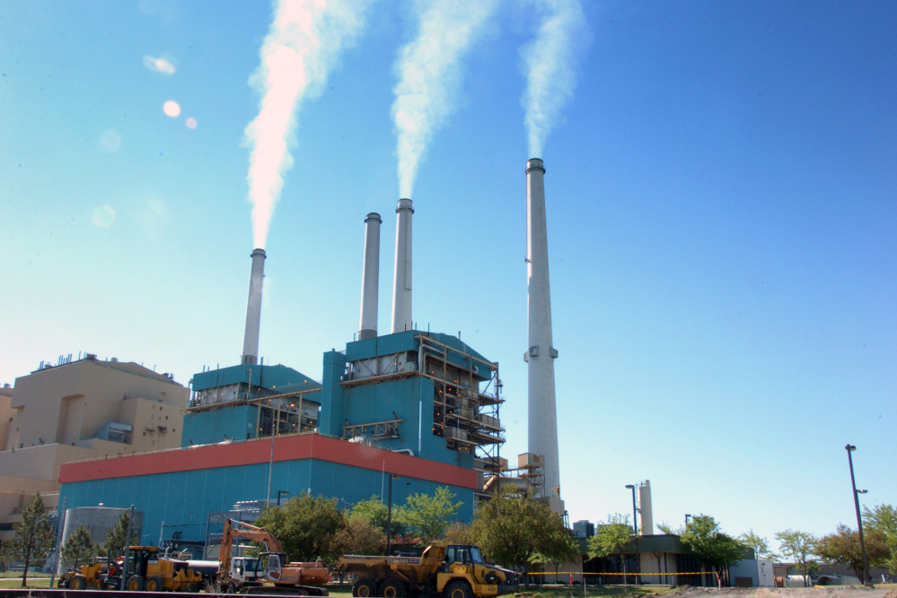 Smoke rises from the Colstrip Steam Electric Station, a coal-burning power plant in in Colstrip, Mont.