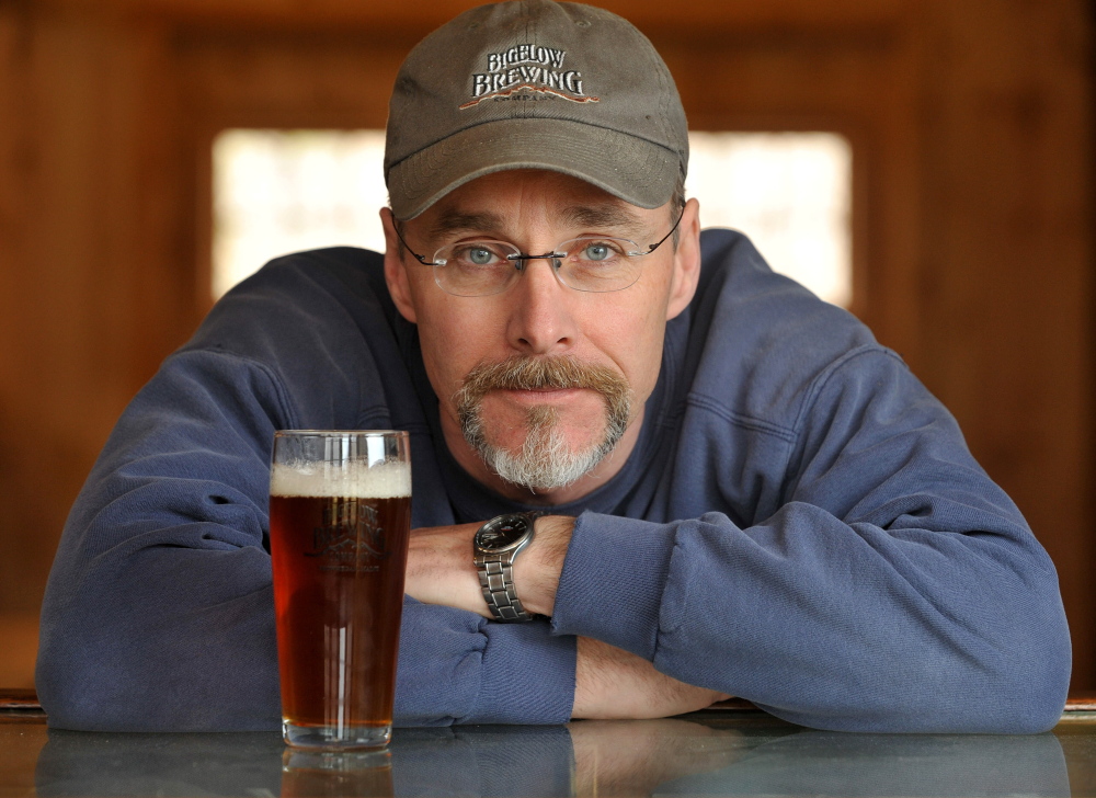 Brewer: Jeff Powers, owner of Bigelow Brewing Company, with his pale ale, Lying Bastard, in his brewery in Skowhegan on Tuesday. Bigelow Brewing Company has an open house on Saturday at the 473 Bigelow Hill Road location and will be offering free samples.