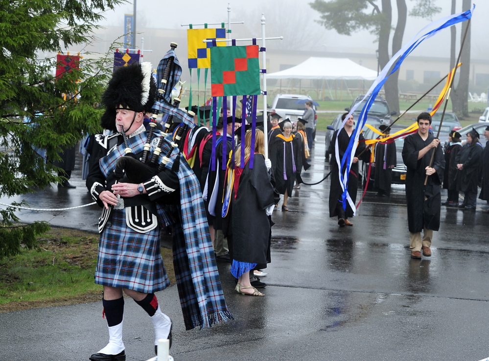 Bagpiper Robert Gillis leads the graduates to the Saint Joseph’s College graduation ceremony in Standish.