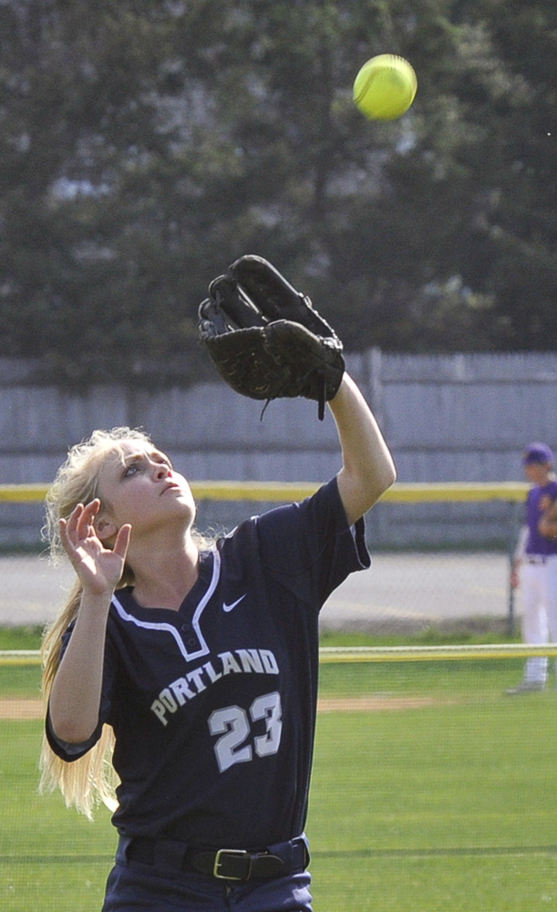 Portland center fielder Morgan Heathcoat keeps her eyes on the ball and makes the catch Monday. Heathcoat also had two hits.
