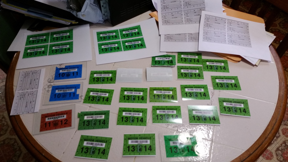 Police say they seized 37 counterfeit vehicle inspection stickers, proofs of the stickers, a computer and a printer at a Lewiston house. Fake stickers likely sold for $100 or more each.