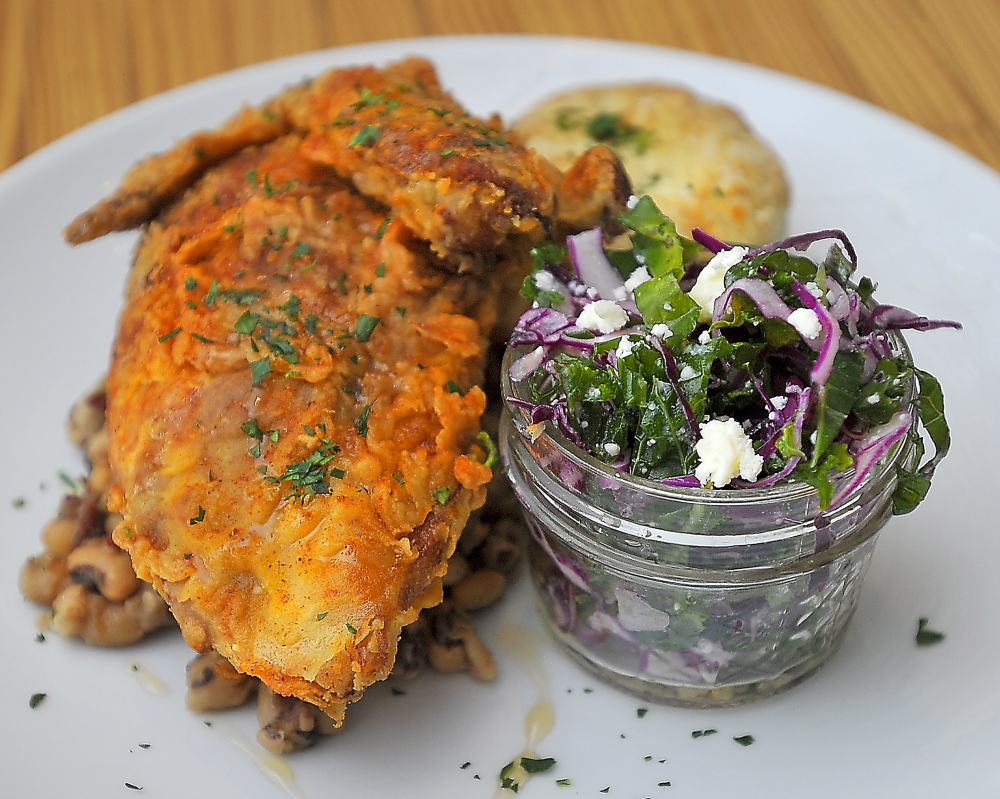 Cold-smoked free-range chicken breast with Tabasco honey is served at 3 Crow with kale slaw, black-eyed peas and a fresh buttermilk biscuit.