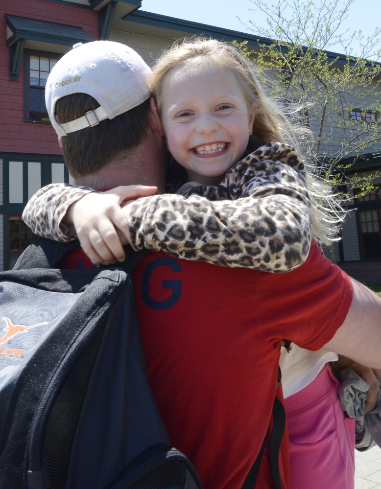 Isabella Bazata shares a joyful greeting with Olympic swimmer Ian Crocker. She introduced her hero by calling him "a brave person because he fought for his dream."