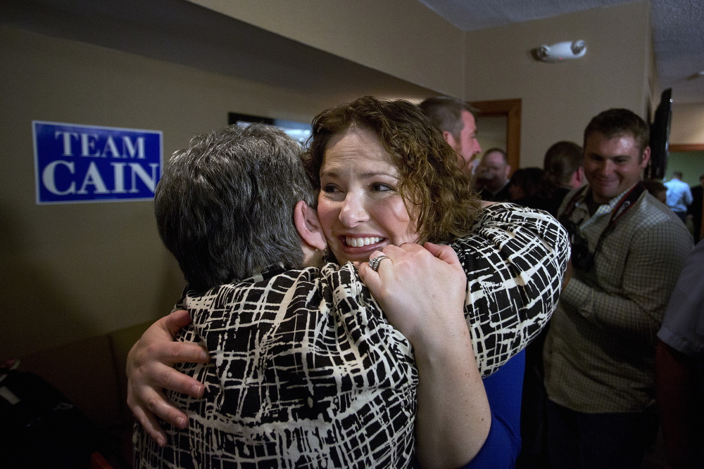 Emily Cain, Democratic victor in the 2nd Congressional District primary, hugs a supporter at the Holiday Inn in Bangor after she defeated her opponent, Troy Jackson. Gabe Souza/Staff Photographer