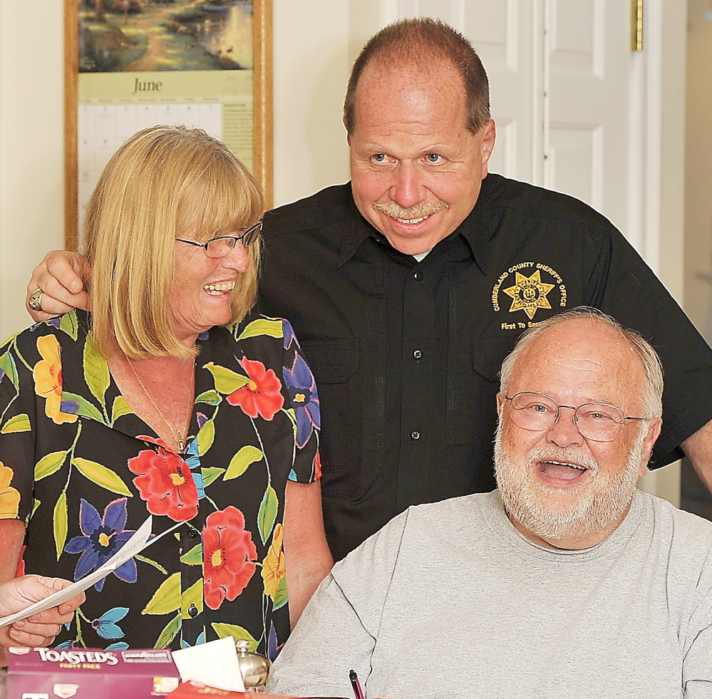 Gordon Chibroski/Staff Photographer Penny Joyce, Sheriff Kevin Joyce and Richard Braus, sitting, react Tuesday to early returns showing Joyce leading in the Democratic primary against Michael Edes, a former state trooper.