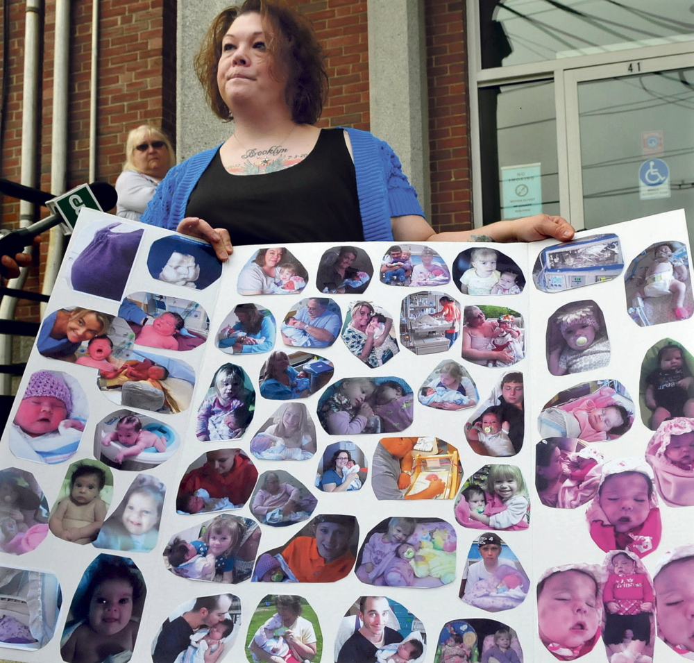 Nicole Greenaway holds a large poster with pictures of her infant daughter, Brooklyn Foss-Greenaway, on the steps of the Somerset Superior Court in Skowhegan on May 21, shortly before hearings began that led to Kelli Murphy admitting to committing unspecified misdemeanors in the baby’s death.