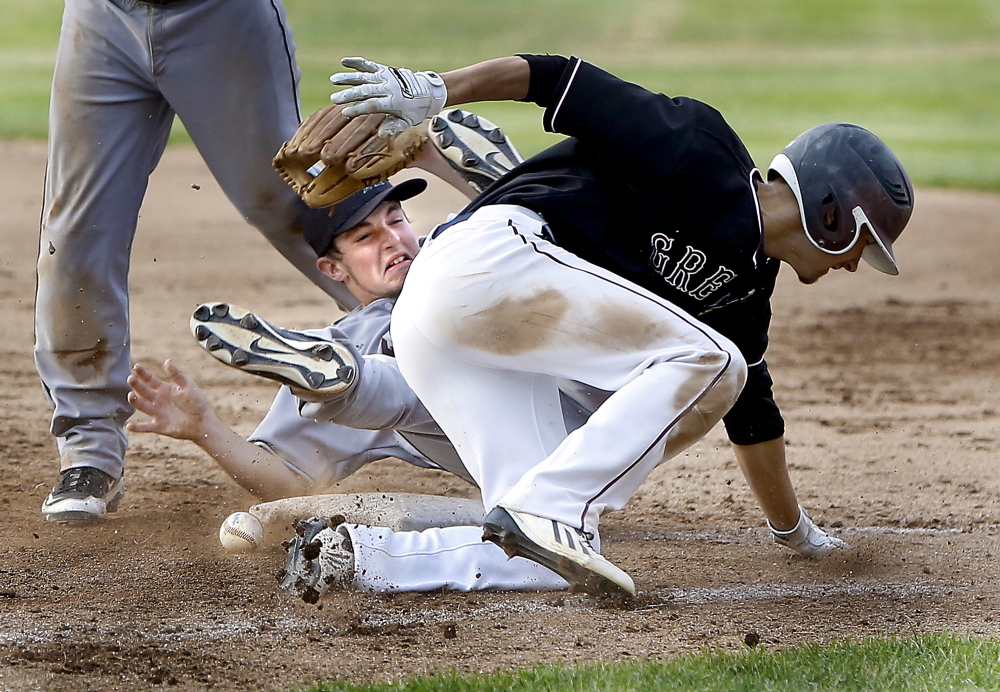 Miles Shields, foreground, of Greely collides with Lincoln Academy pitcher Sawyer Pinkham, who was covering first base on a grounder Wednesday during their Western Class B championship game. Shields was called out. Greely won 3-0 and will take on Caribou for the state title Saturday.