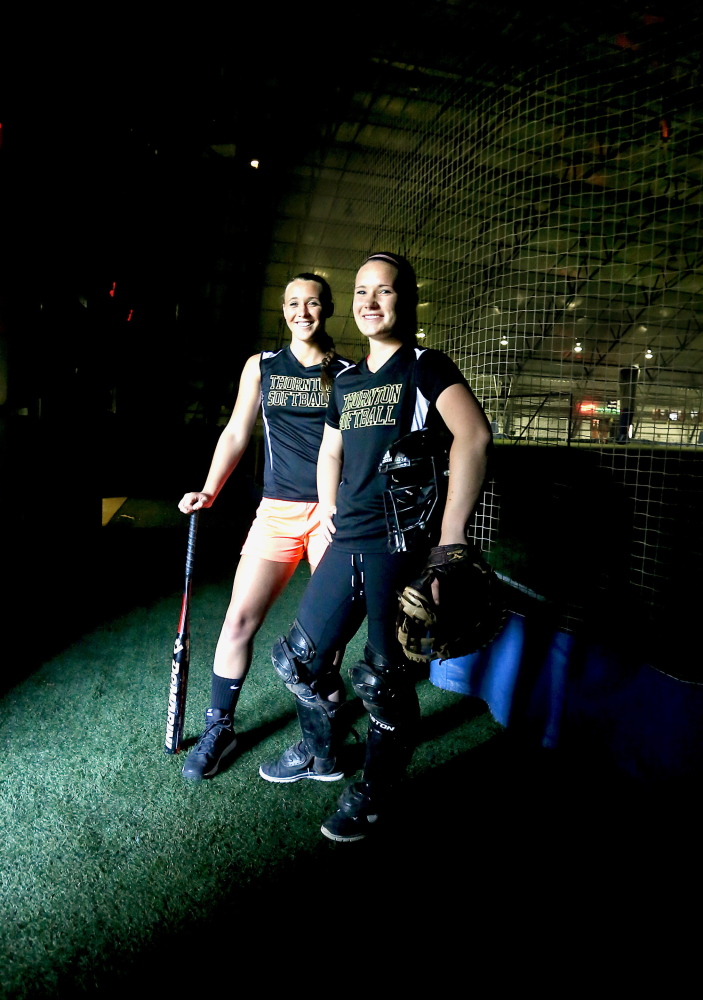 Brooke Cross, left, a junior shortstop, and her sister, senior catcher Aleisha Cross, have found the perfect way to end their time as Thornton Academy teammates – playing for a state softball title.