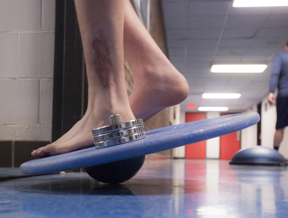 Cal Schaefer goes through his daily therapy, 10 months into rehab from a play that left him with two broken bones, a skin graft and a pile of medical bills.