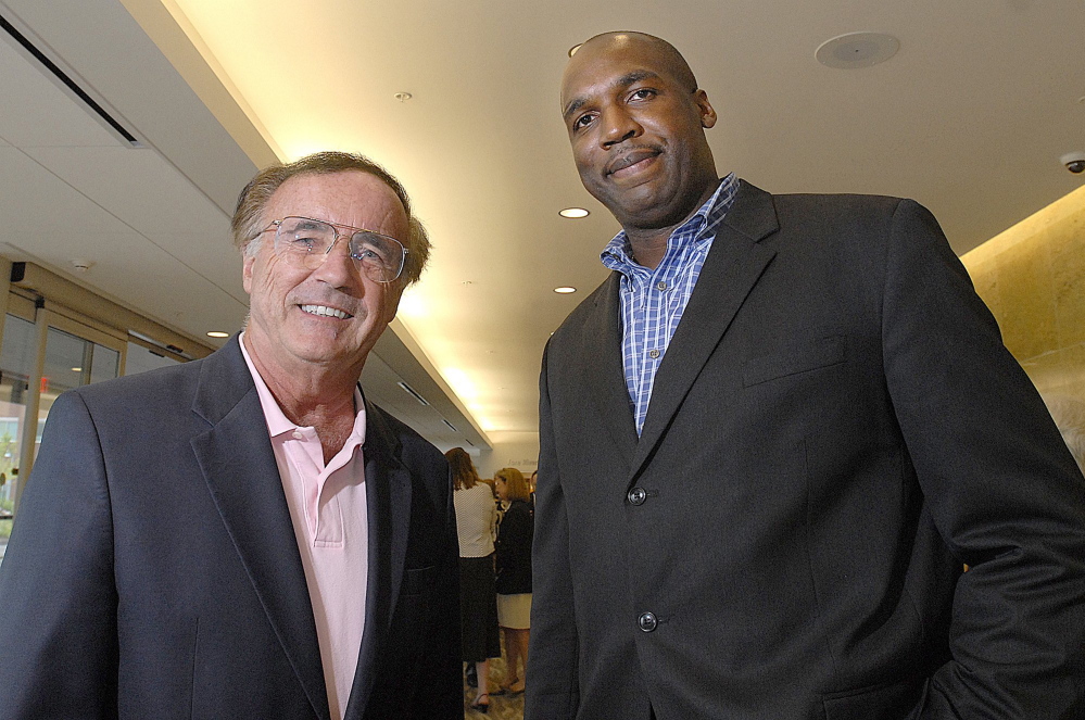 Staff Photo by Doug Jones
In this file photo, John Leonard, left, of Memic, with Dajuan Eubanks.