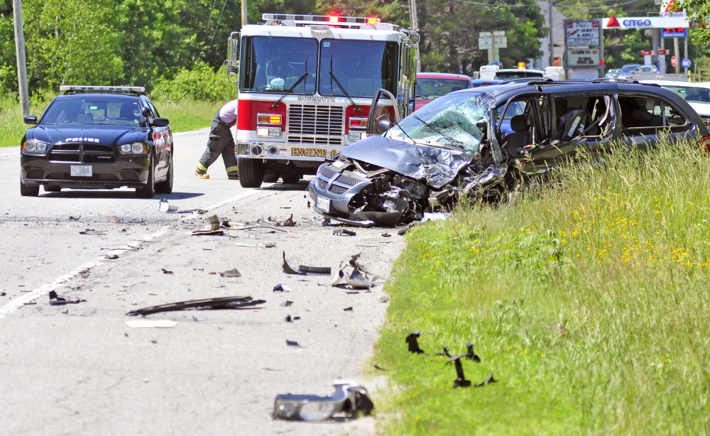 A van sits on the side of Route 202 after it was involved in a head-on collision Friday near T.J.’s Pizzeria in North Monmouth. The driver was taken to a hospital with serious injuries.